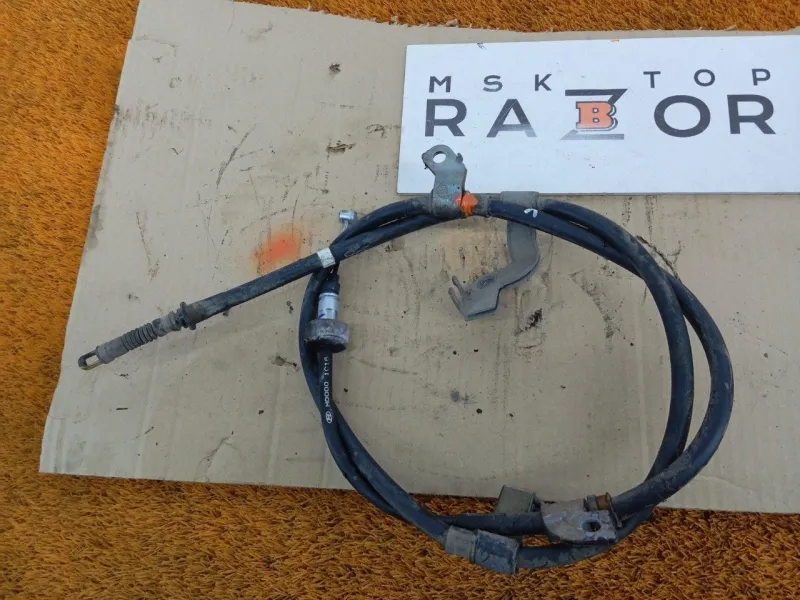 Трос стояночного тормоза