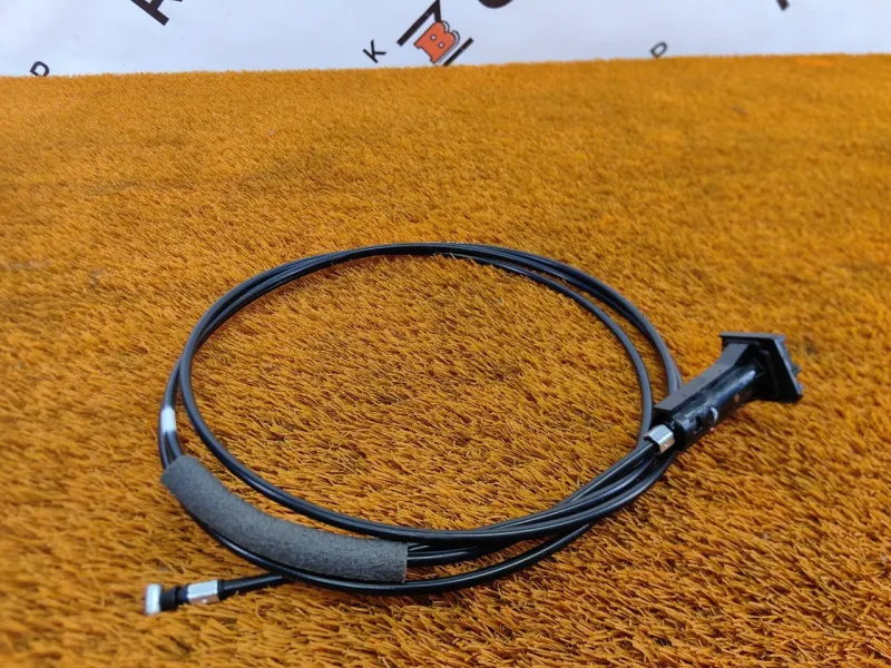 Трос лючка топливного бака