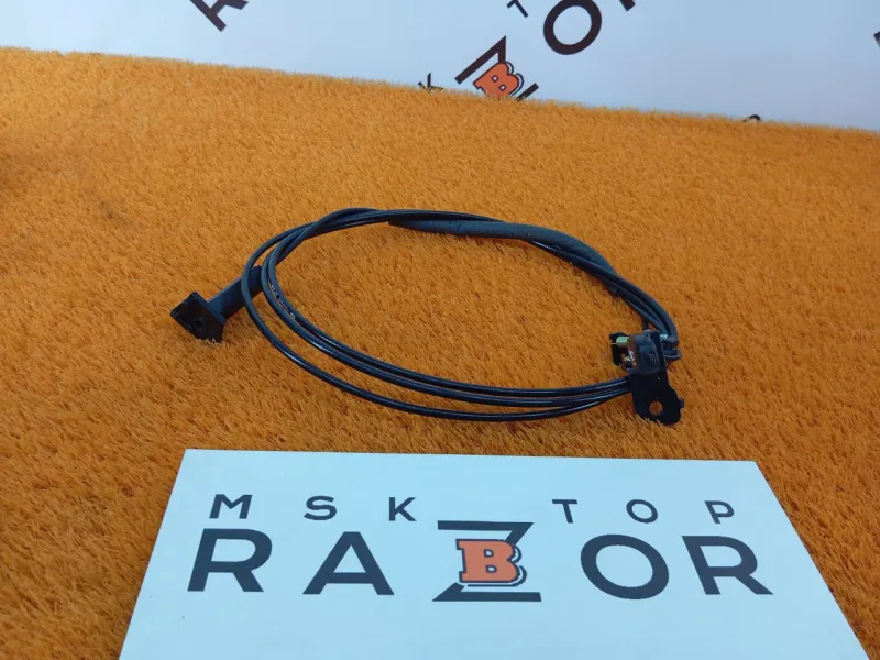 Трос лючка топливного бака