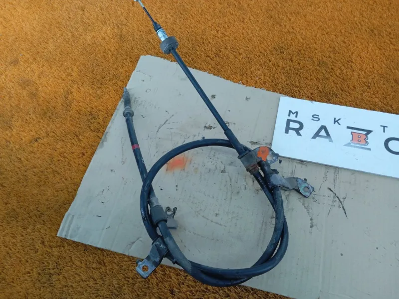 Трос стояночного тормоза