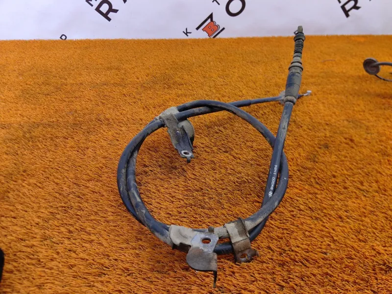 Трос стояночного тормоза