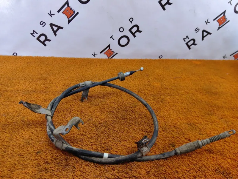 Трос стояночного тормоза