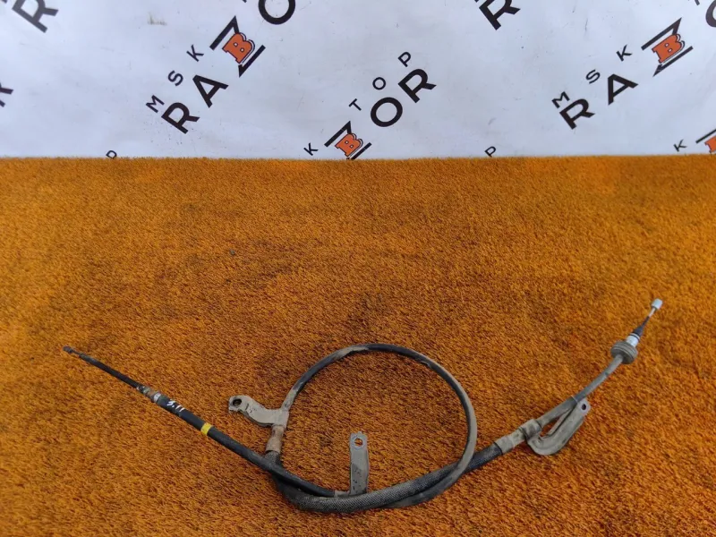 Трос стояночного тормоза